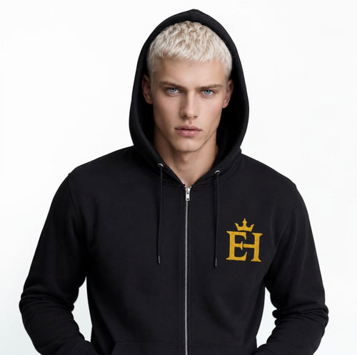 Clean male front portrait with the hood up. Reinforces the unisex identity and premium streetwear presence of the piece.