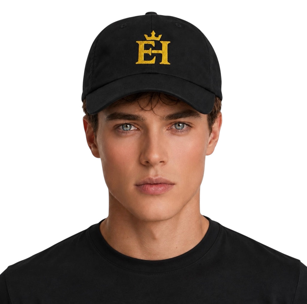 Man wearing a black EH Crown Signature Classic Cap with gold embroidered EH Crown logo, front view.