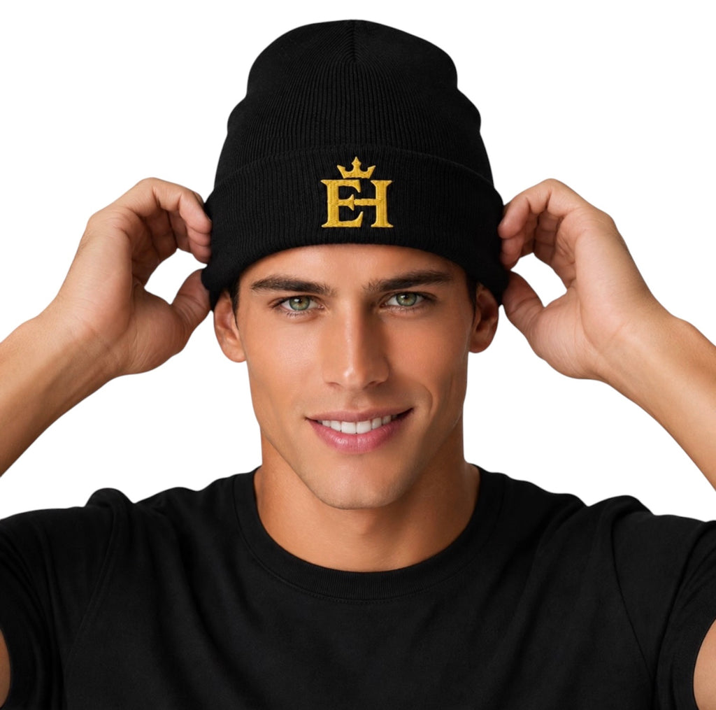 Man adjusting a black EH Crown Signature Cuffed Beanie with gold embroidered EH Crown logo