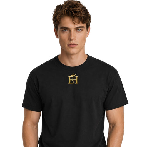 Front view of a man wearing the black EH Crown Signature Heavyweight T-Shirt with gold EH Crown logo on a light neutral background.