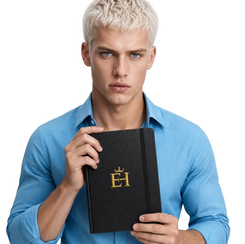 Man holding the black EH Crown Signature Premium Hardcover Notebook with gold logo