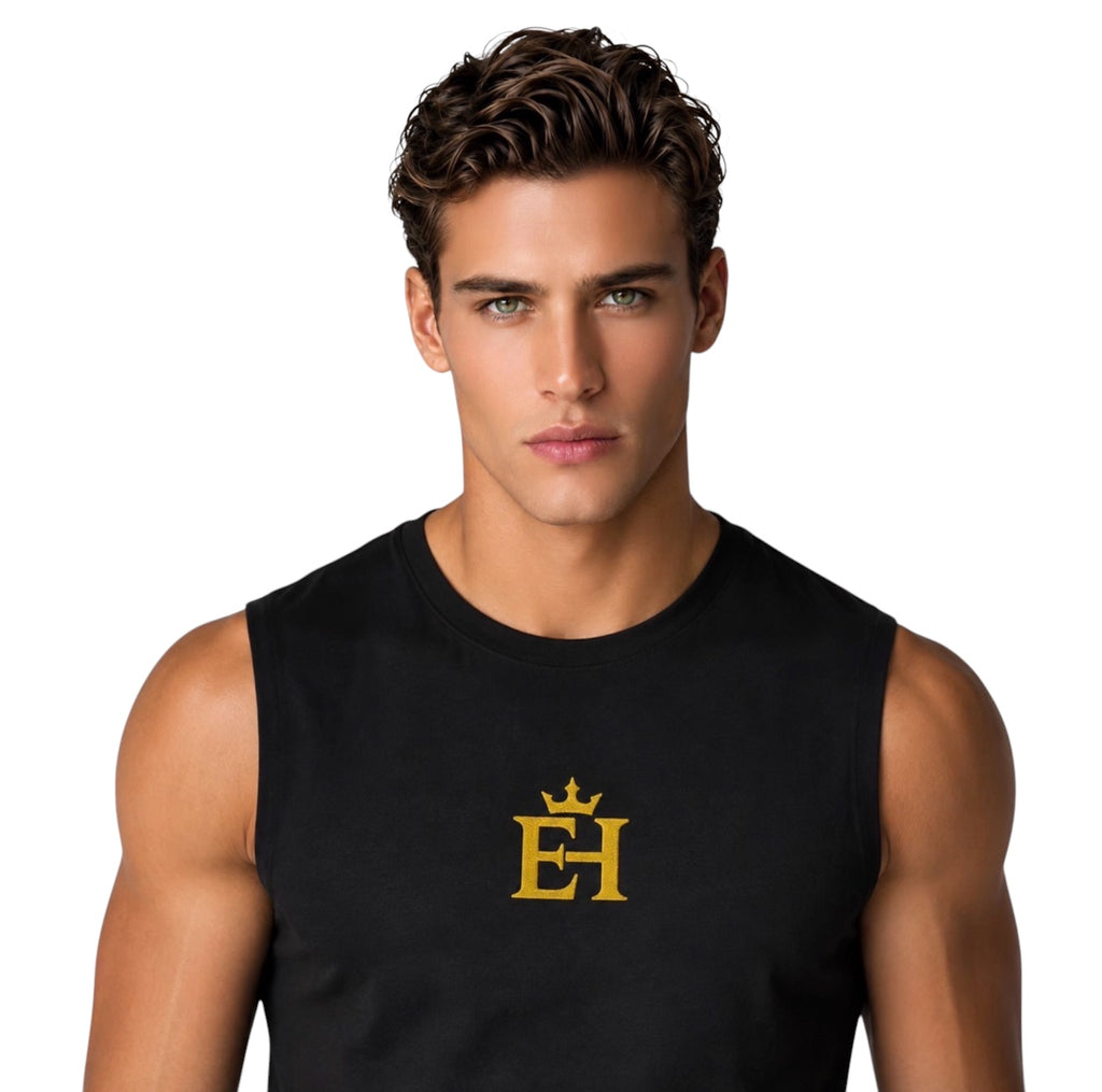 Close-up of a man wearing a black premium muscle tank with gold EH Crown embroidery.