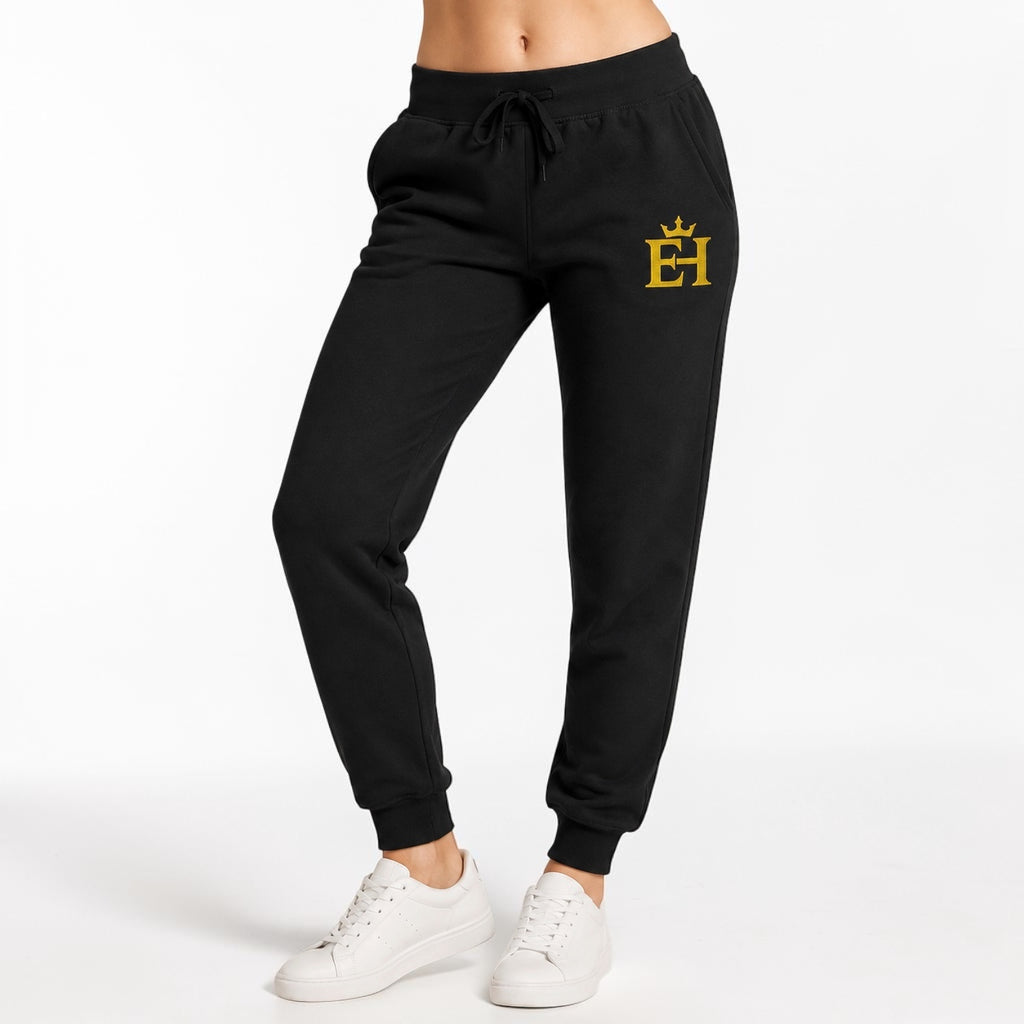 Close-up of black EH Crown Signature Premium Sweatpants showing the gold EH Crown embroidery and drawstring waist.
