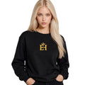 Woman wearing the black EH Crown Signature Premium Sweatshirt with gold embroidered EH Crown logo, front view.
