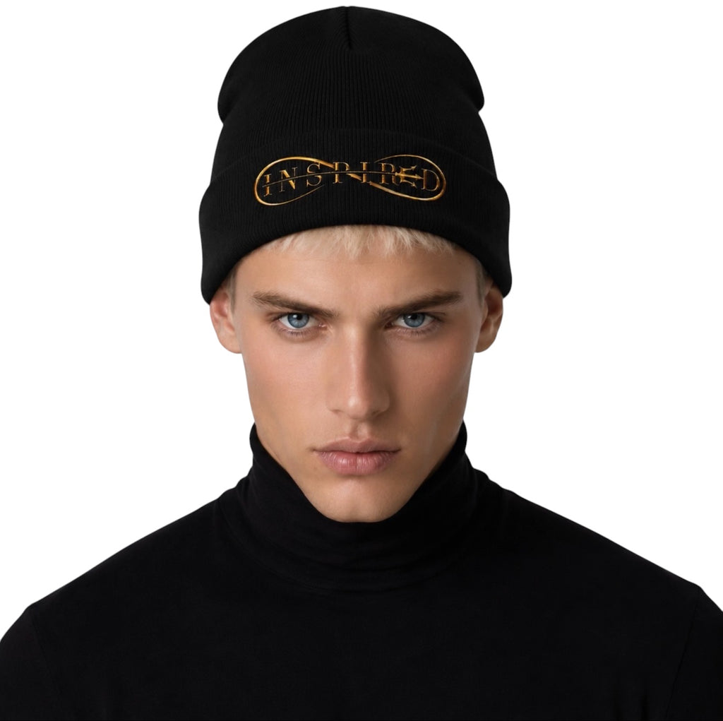 Man wearing black INSPIRED cuffed beanie with gold embroidered logo front portrait