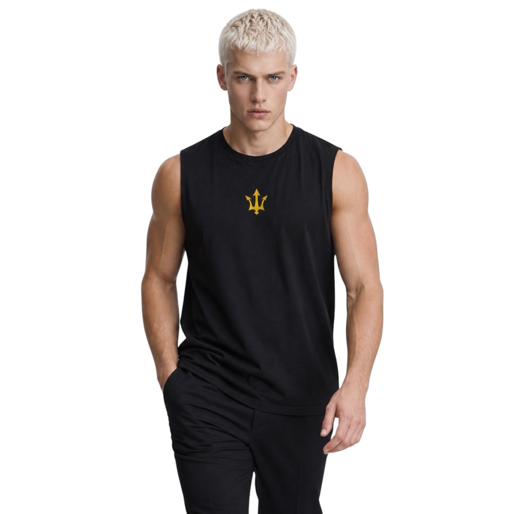 Male model wearing the black INSPIRED Muscle Tank with gold infinity-trident emblem, full-body view.