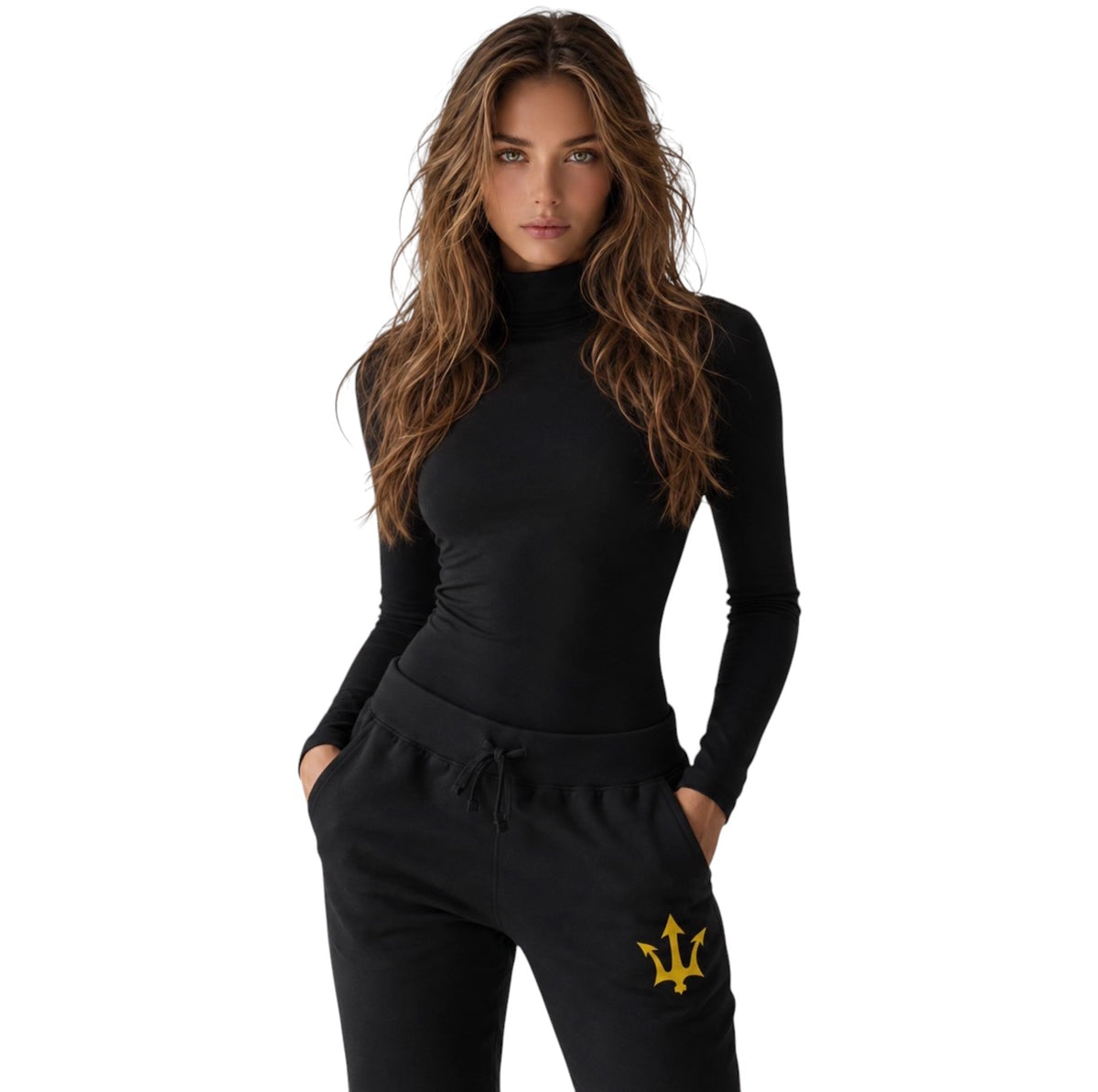 Female model wearing INSPIRED Sweatpants in black with gold infinity-trident emblem, front close-up view.