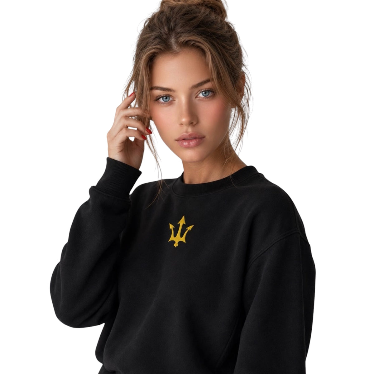 Female model wearing the INSPIRED Sweatshirt in black with gold infinity-trident emblem, angled close-up view.