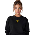 Female model wearing the INSPIRED Sweatshirt in black with gold infinity-trident emblem, front portrait view.